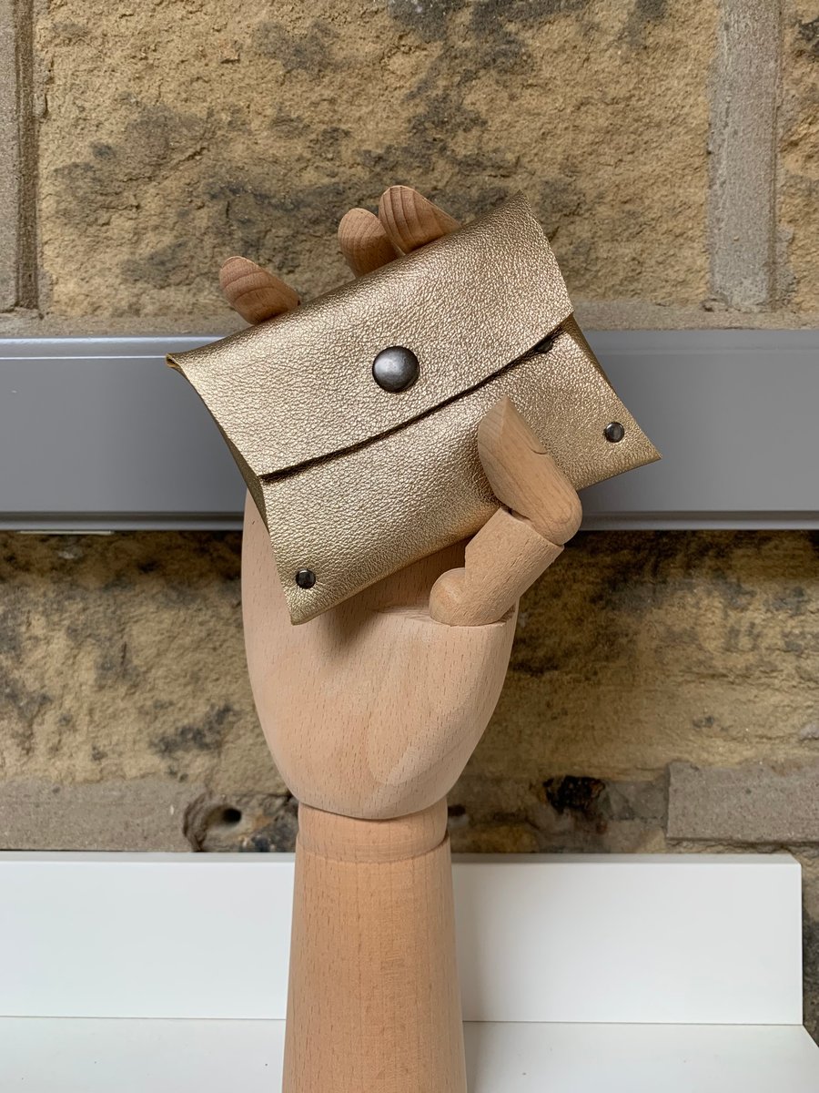 Leather purse in gold metallic