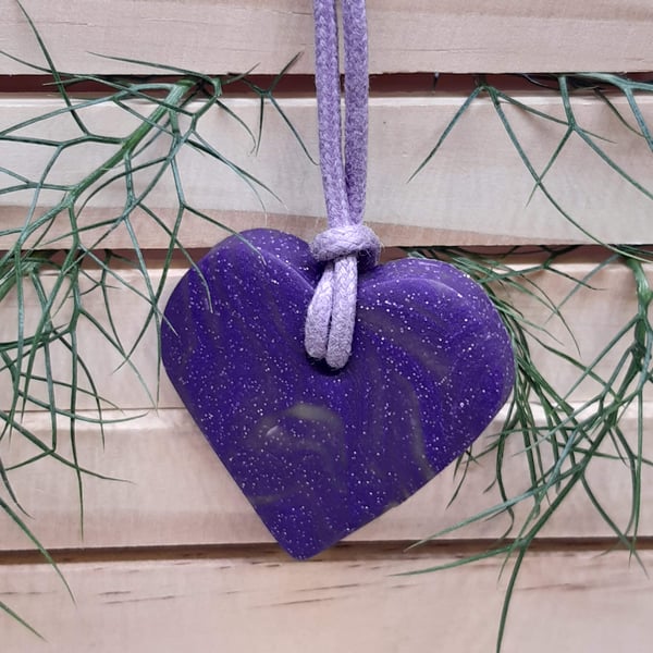 Heart shaped sparkly purple pendant
