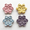 Set of four flower shaped ceramic handmade buttons