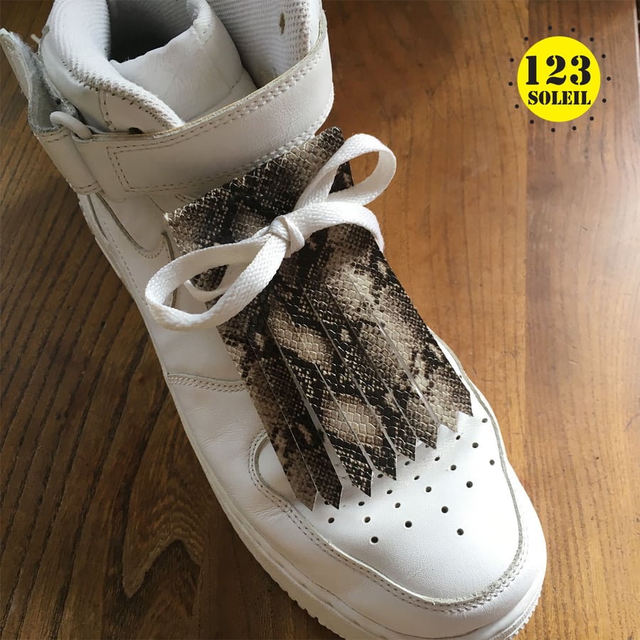 shoe accessory, removable fringe, leather accessory, python print