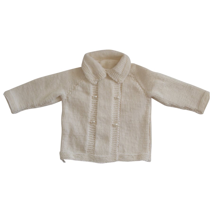 Hand knitted white coat for babies