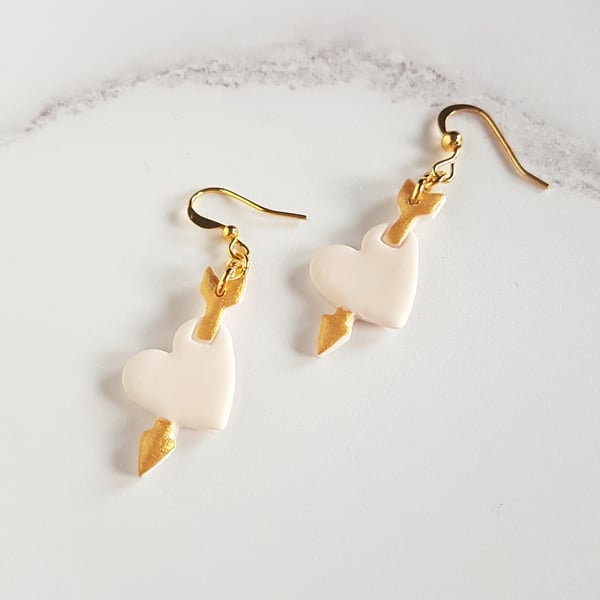 Cupid's arrow white and gold drop earrings