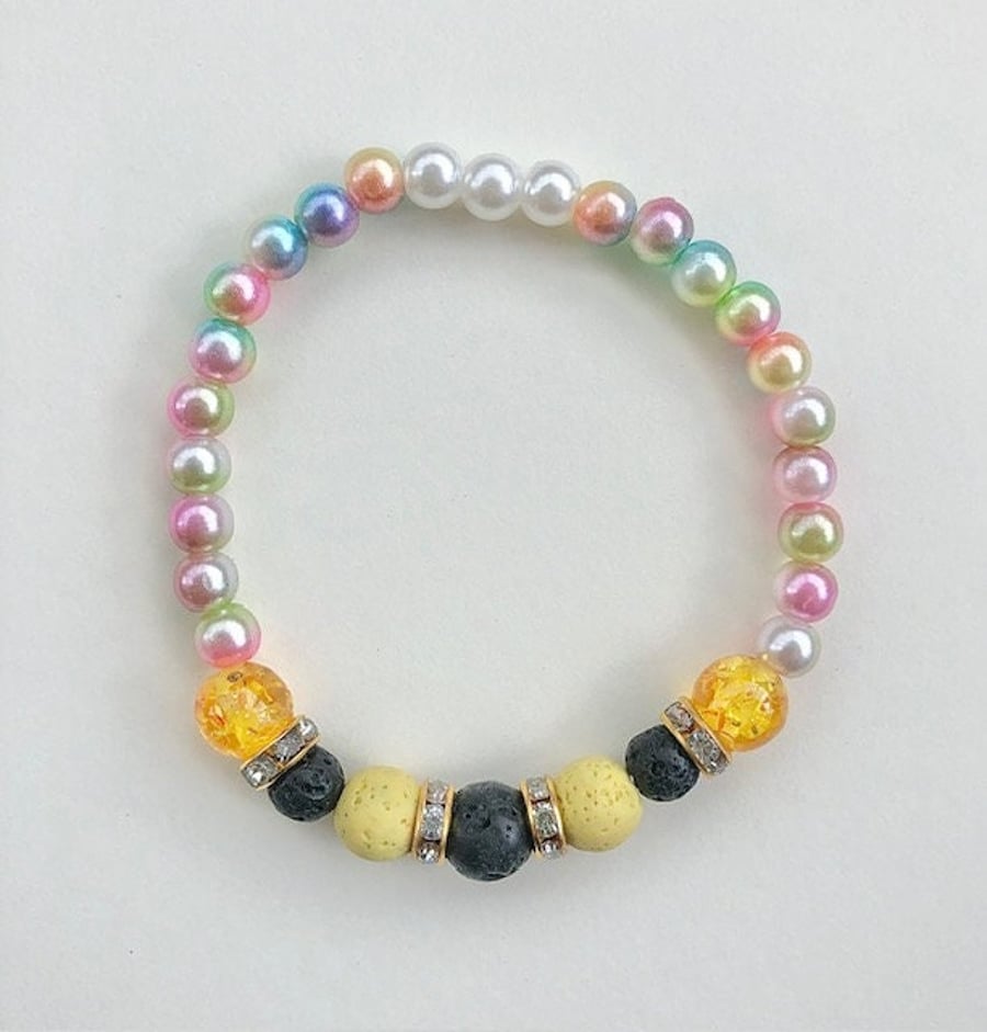 Lava bead bracelet in yellow & black - aromatherapy -elasticated approx.7 inches