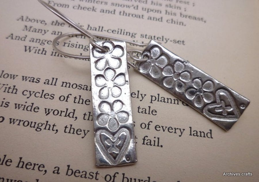 Hearts and flowers dangle earrings.