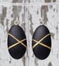 Black pebble earrings, inspired by nature with gold lines and silver earwires