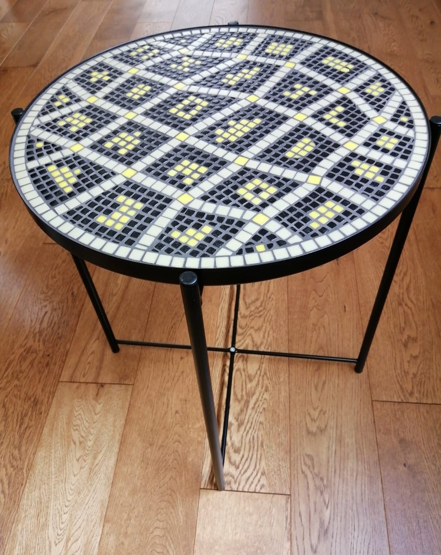 Attractive black table mosaiced with olive, black and yellow recycled glass tile
