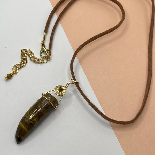 Yellow tiger's eye horn pendant with copper wirework