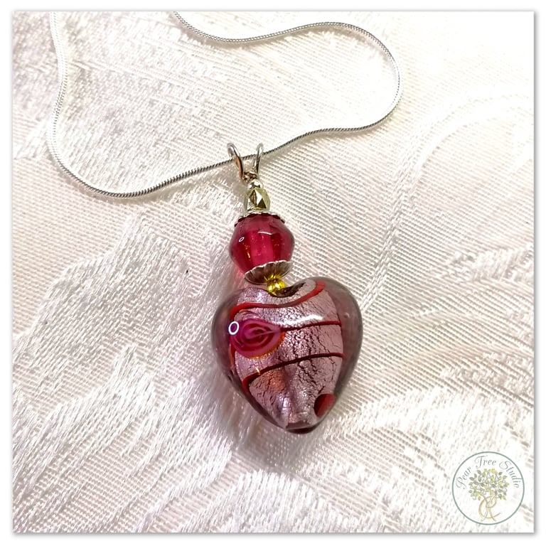 Dark pink Murano glass heart necklace on a silver plated chain