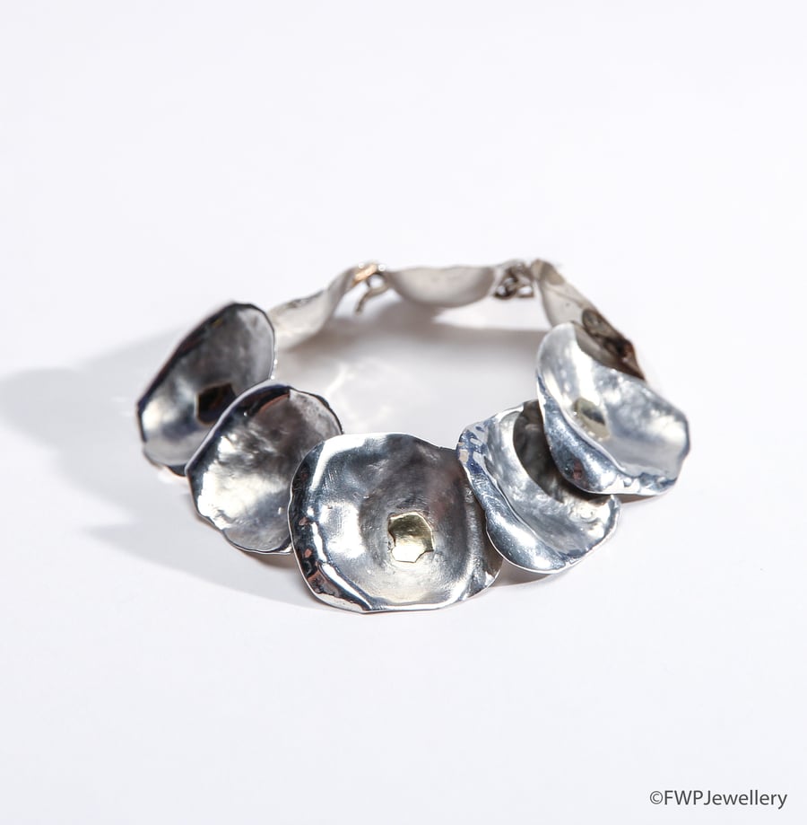 Silver bracelet with gold decoration