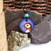 Colourful puffin pyrography wood pendant, rustic branch slice necklace. 