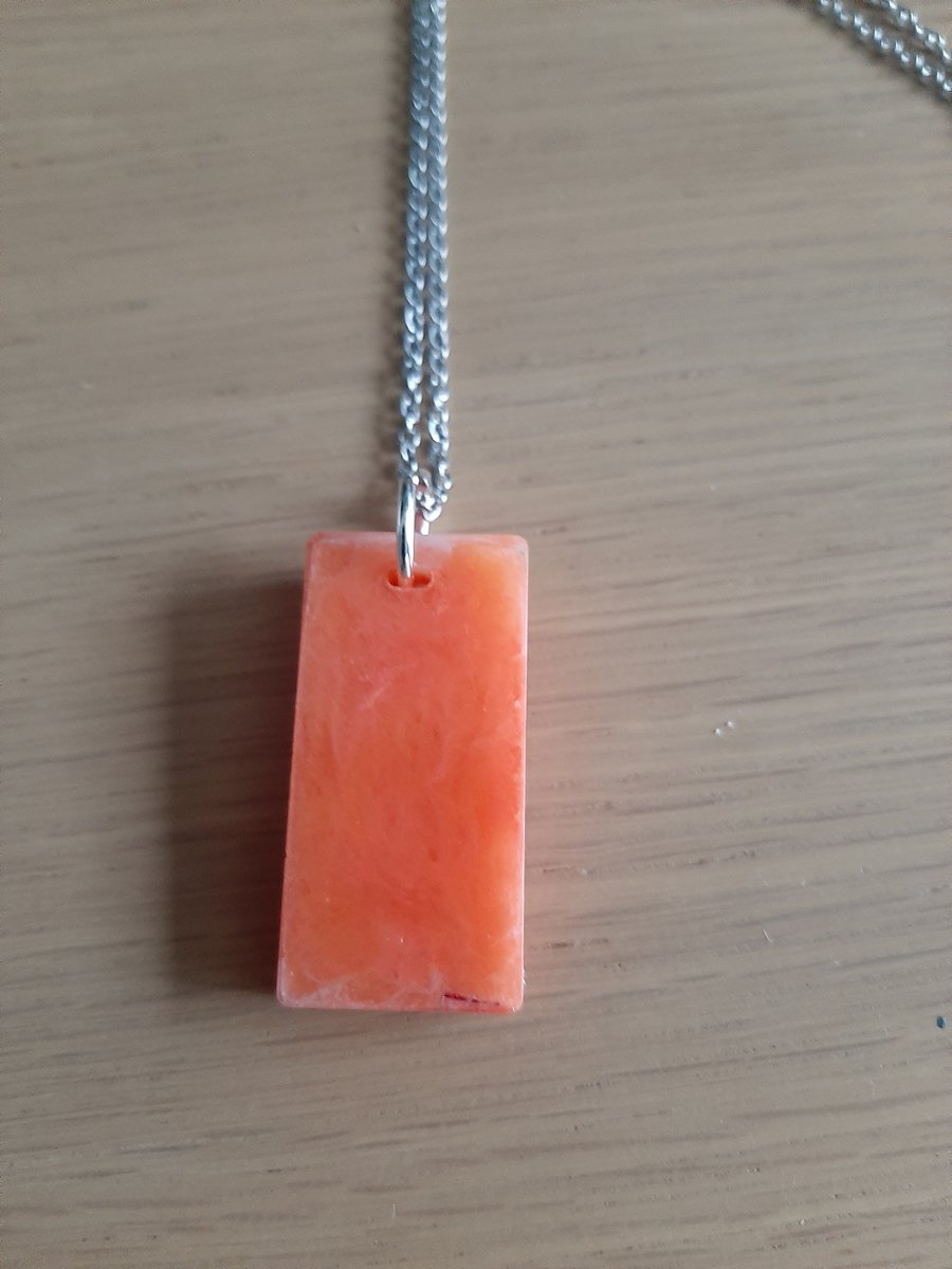 unique handmade 3d orange oblong resin pendent on a chain 