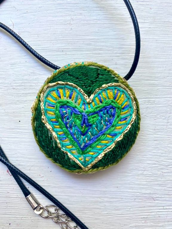 Heart pendant, hand embroidered in shades of green
