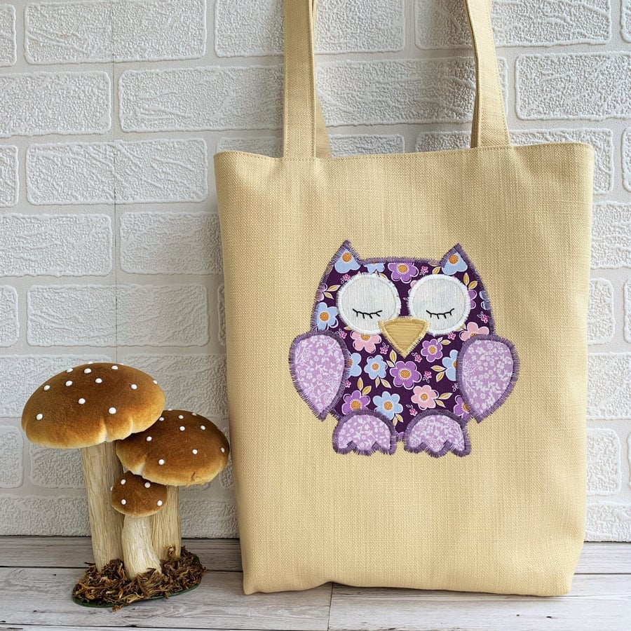 Sleepy owl tote bag in pale golden yellow with purple floral owl