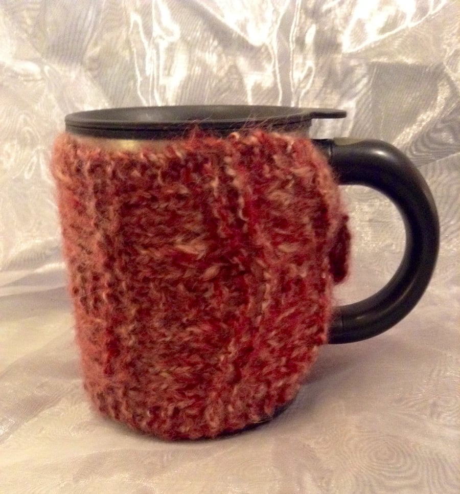 Pink knitted mug warmer