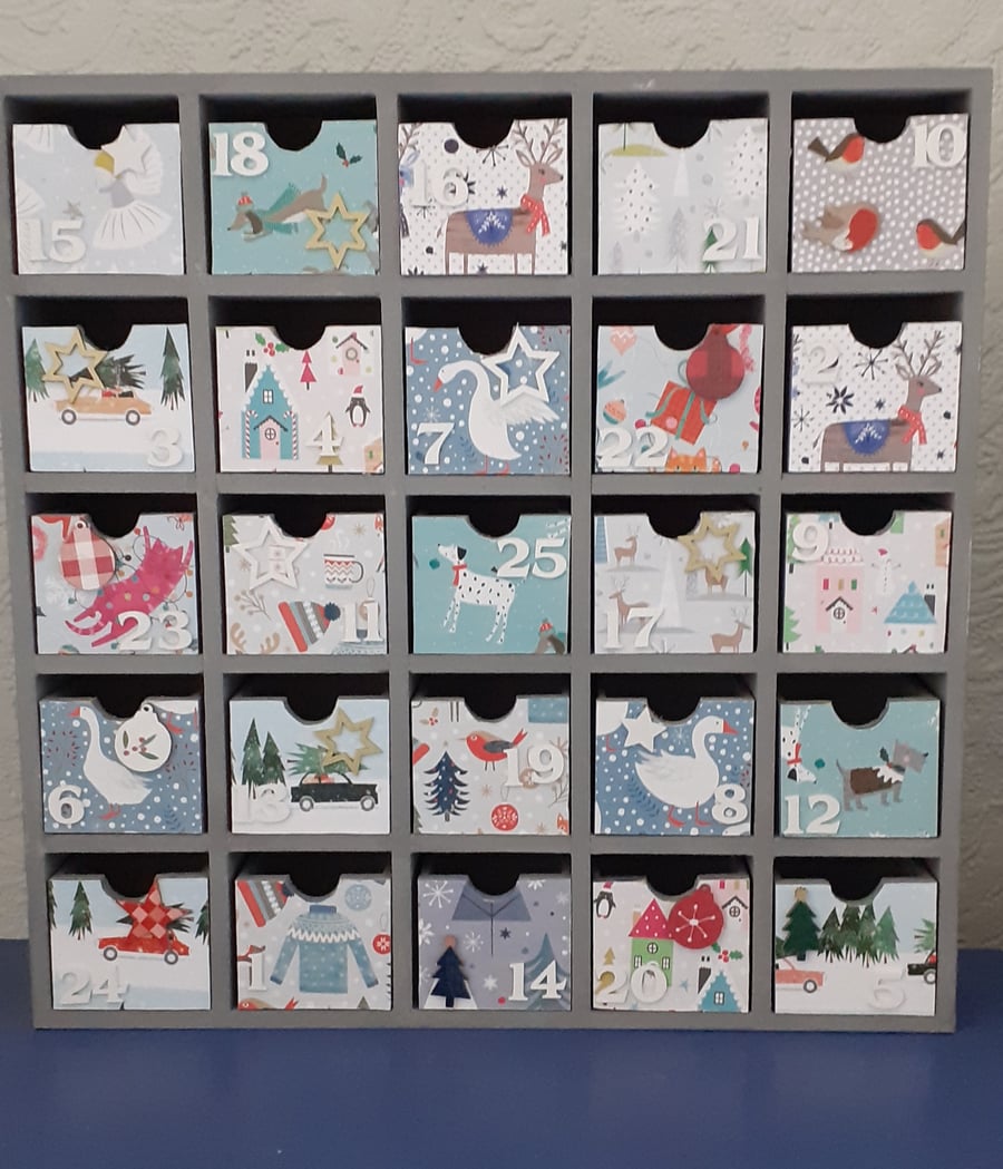 Hand decorated re-useable wooden advent calendar. 