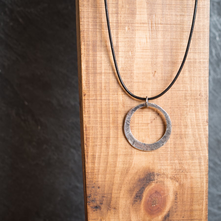 The Orbit Necklace. Textured Sterling Silver Circle on Leather.