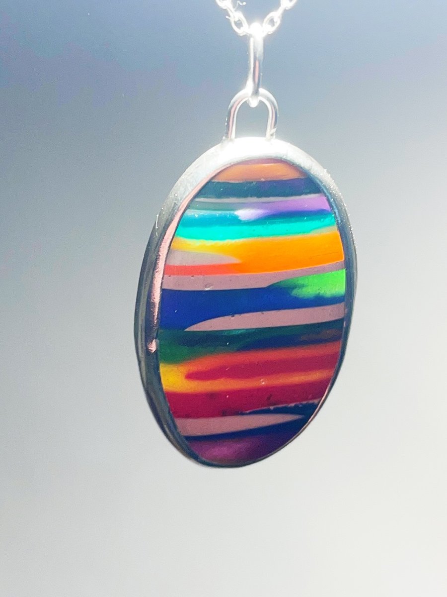 Resin and sterling silver hand carved pendant