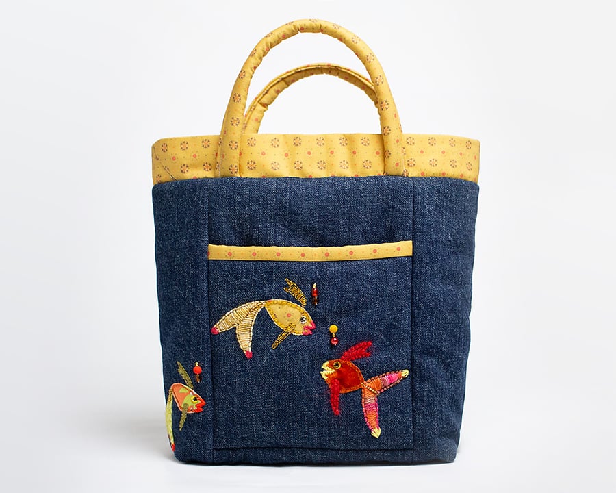 Blue denim bag with front pocket and hand stitched fish