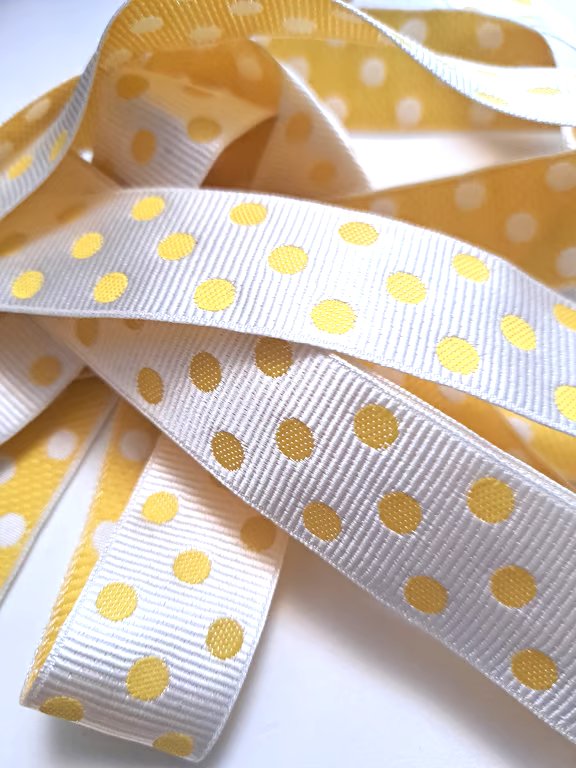 2.5 metres of yellow and white spotty ribbon, 25mm wide