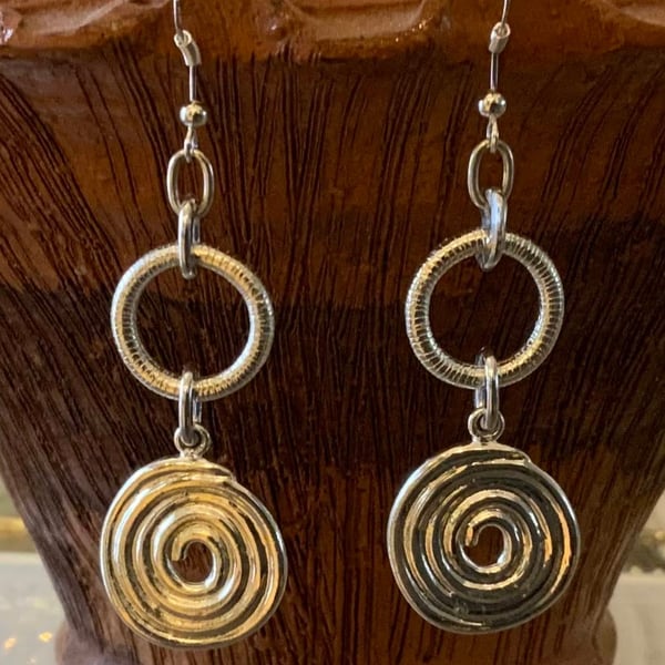 White metal spiral loop earrings
