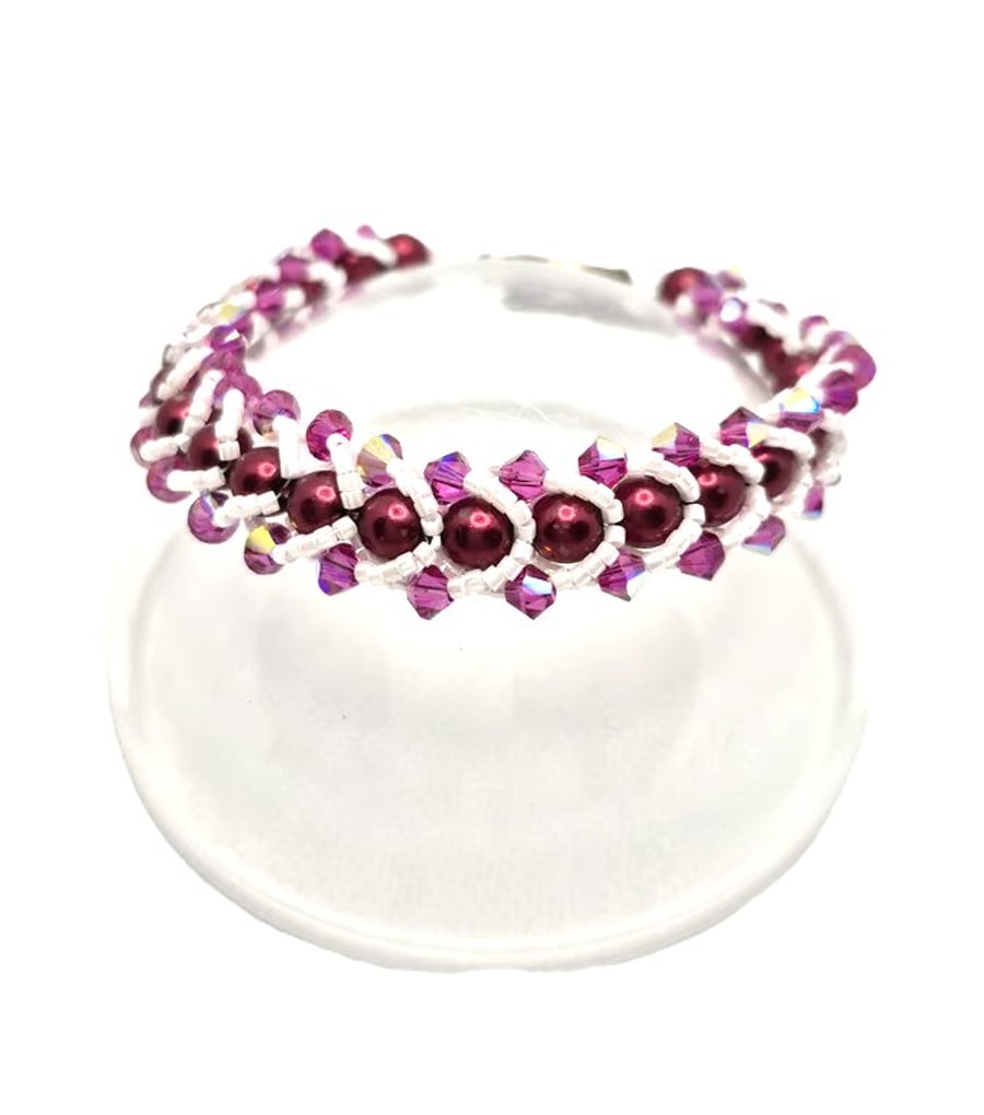 Flat spiral bracelet with red Swarovski pearls and pink AB Swarovski crystals
