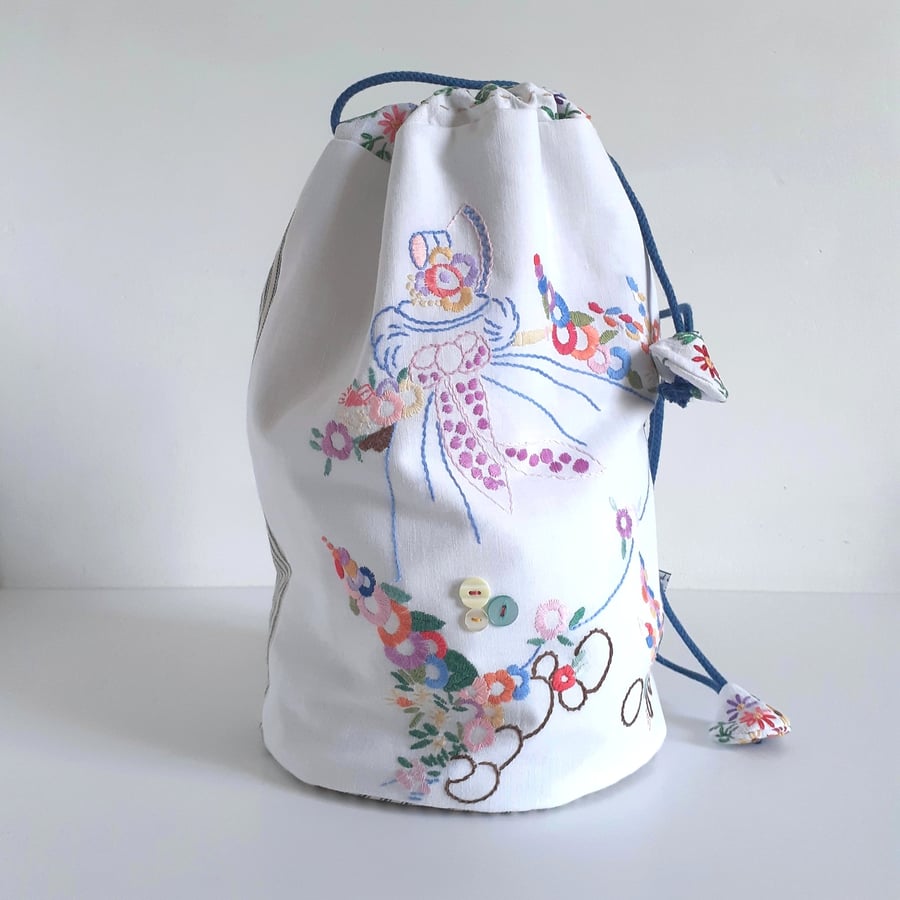 Dolly bag recycled from vintage floral embroidery of a young girl in a crinoline