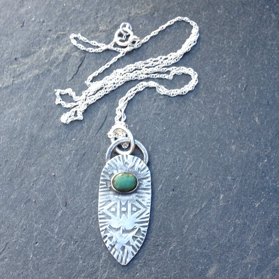Stamped silver and turquoise pendant