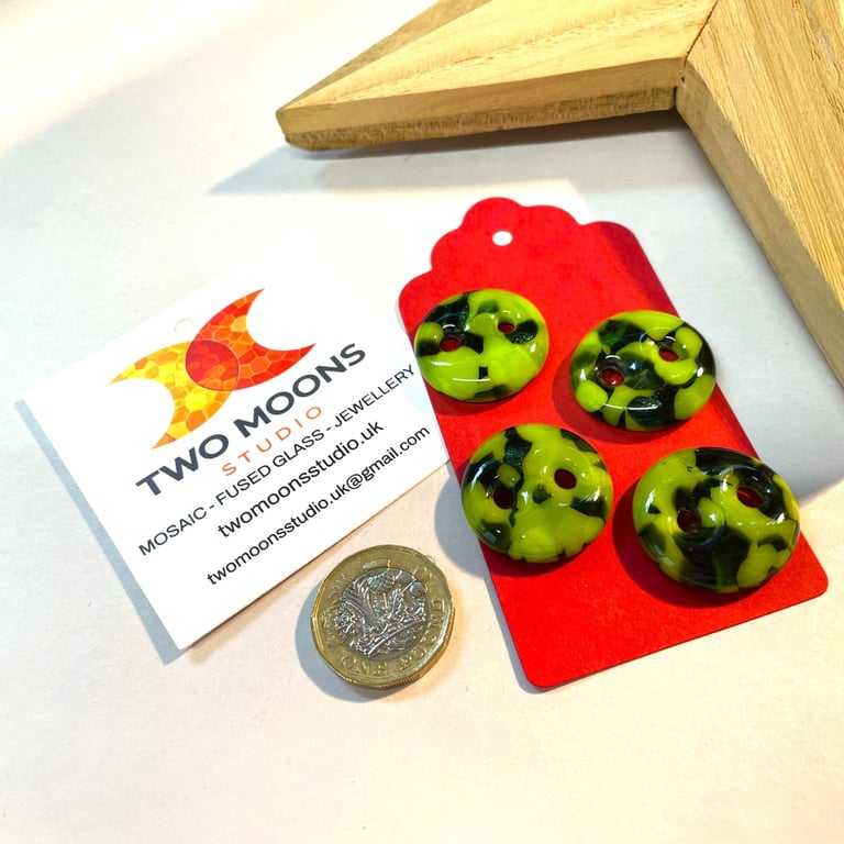 Set of 4 green glass buttons. 