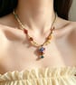Vintage-Inspired Floral Vase Pendant and Multicolour Beaded Necklace