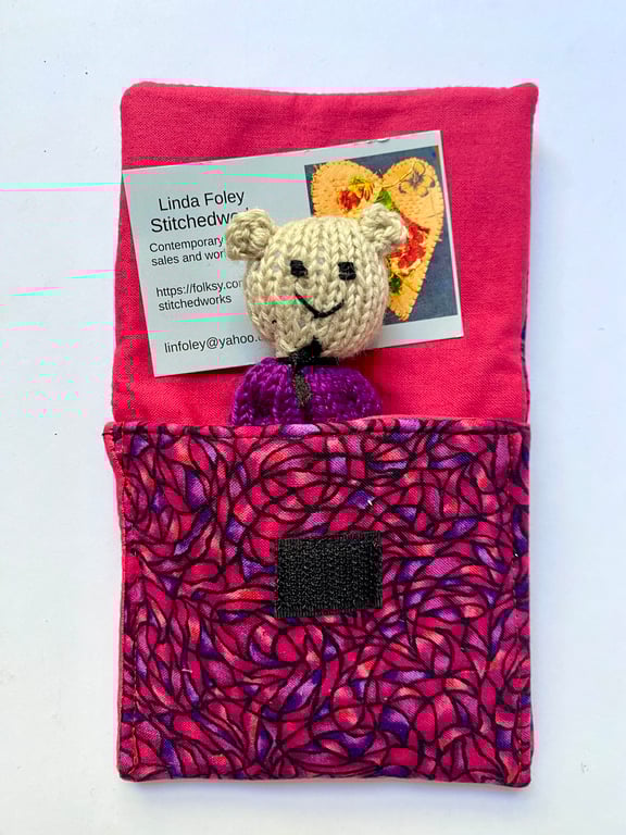Little bear in a bed, hand knitted miniature bear in a purse.