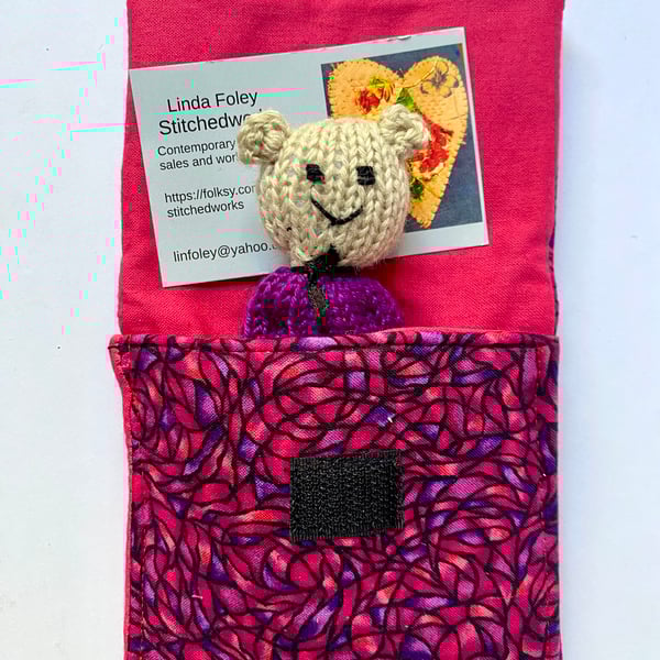 Little bear in a bed, hand knitted miniature bear in a purse.