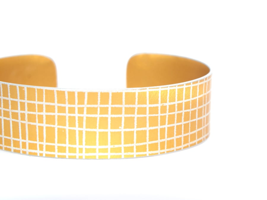 Mustard yellow criss cross aluminium cuff