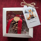 Handmade Christmas decorations pine cone with bow