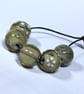 Handmade grey and white lamp work glass beads