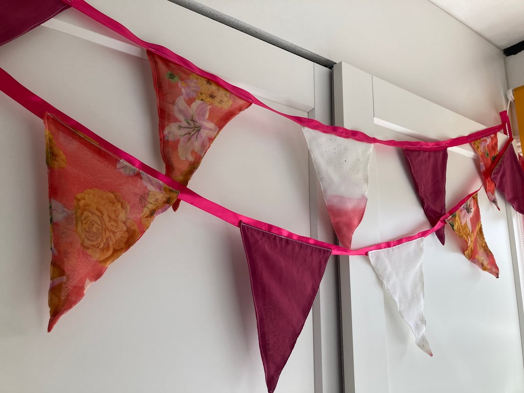 Bunting. Shades of pink and white. Repurposed sari fabric