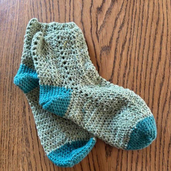 Pair of crochet green and teal socks made using recycled wool blend yarn, size 4