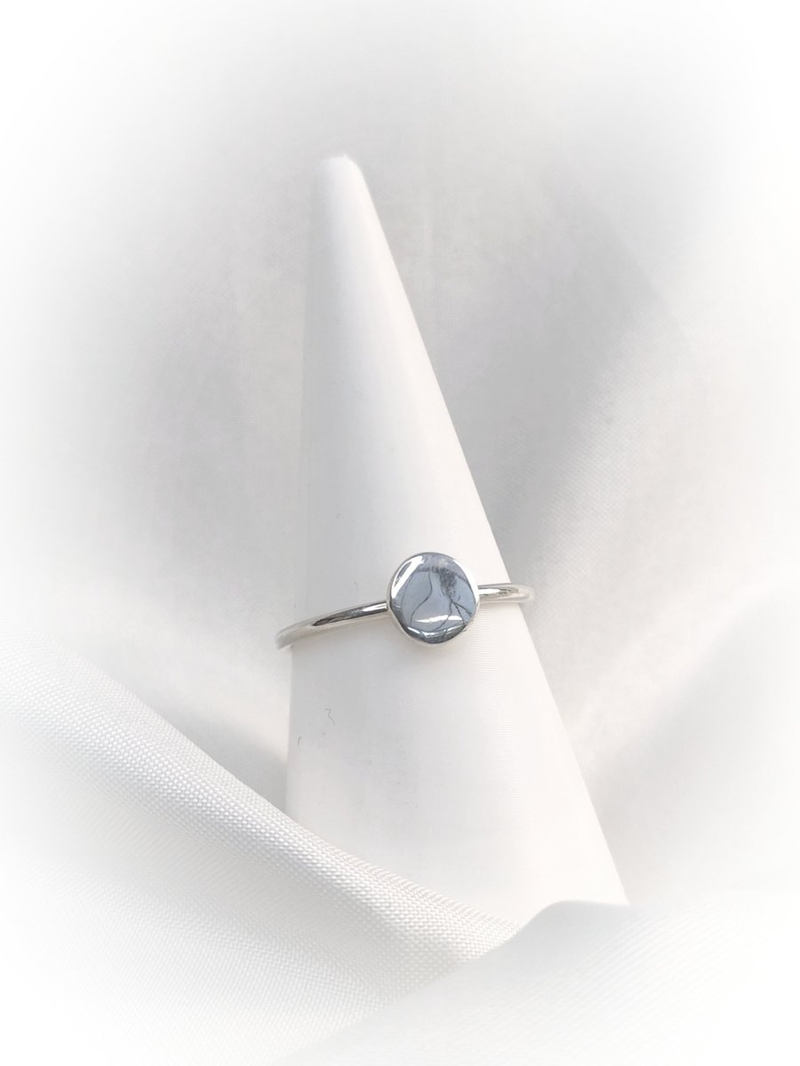 Sterling silver ring with forged disc