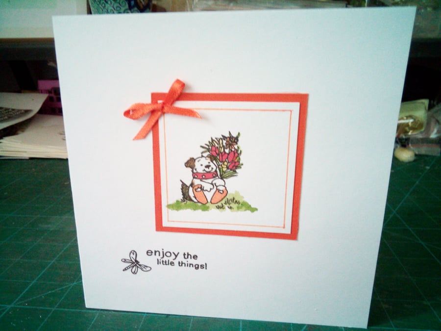 Dog with bouquet birthday card 