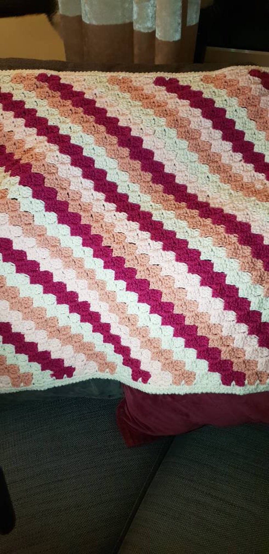 Handmade pink crocheted baby blanket