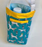 Water bottle carrier with key clip and pocket for phone. Turquoise dogs.