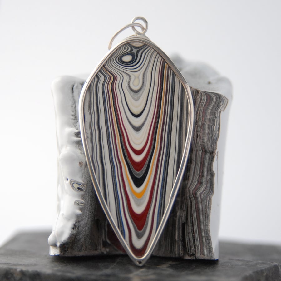 Reversible shield shaped fordite and sterling silver pendant