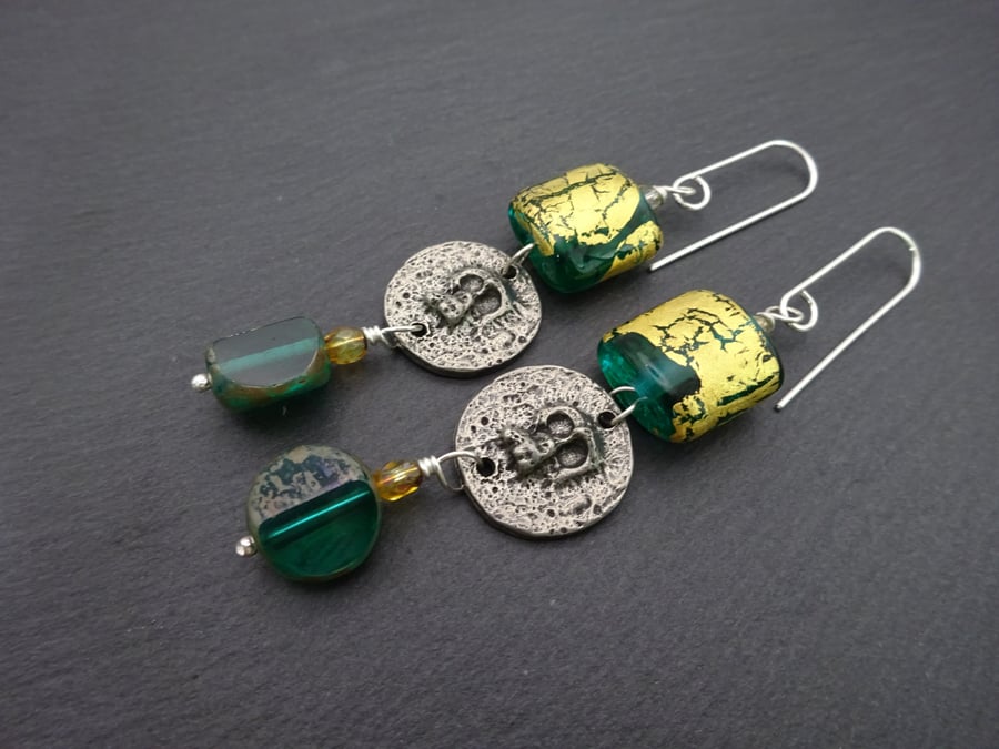 teal green and gold leaf lampwork glass earrings, pewter skull jewellery
