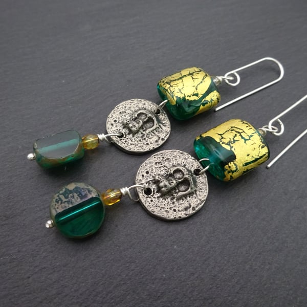 teal green and gold leaf lampwork glass earrings, pewter skull jewellery