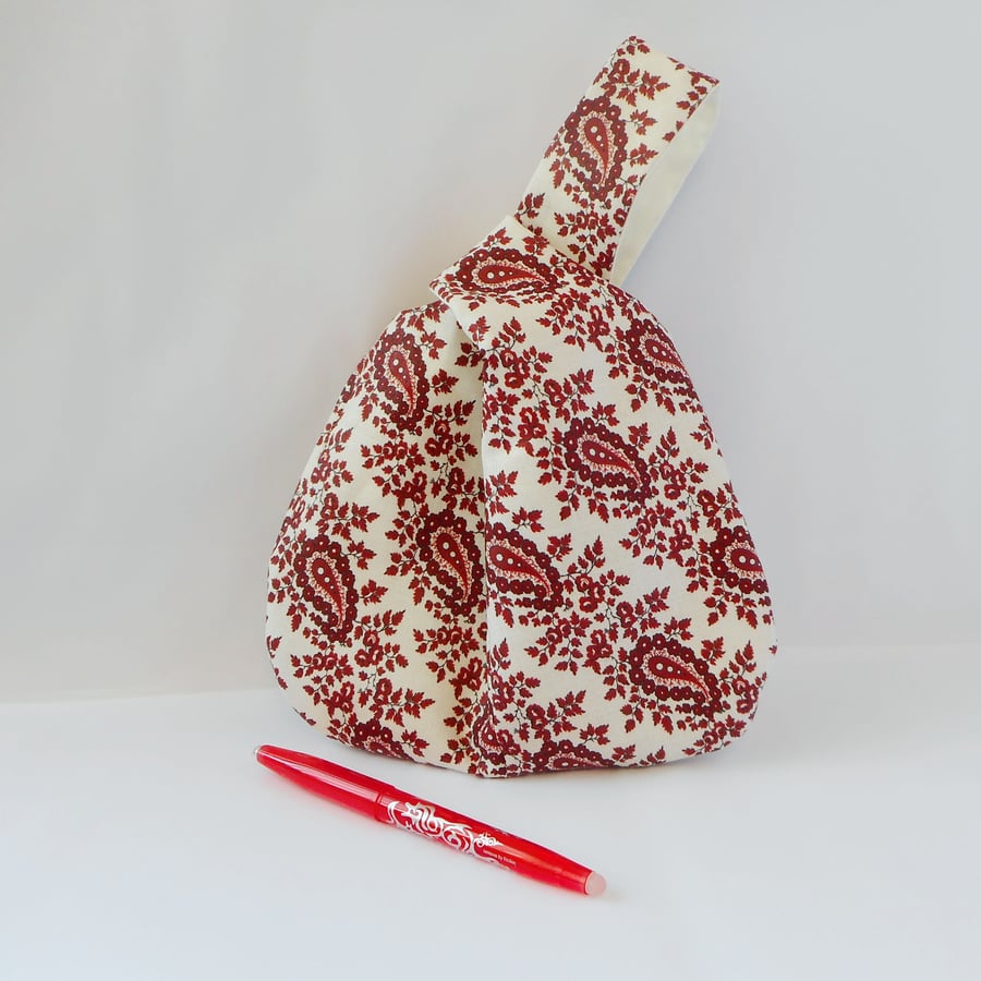 Printed linen, fully lined, Japanese Knot bag in white and deep burgundy