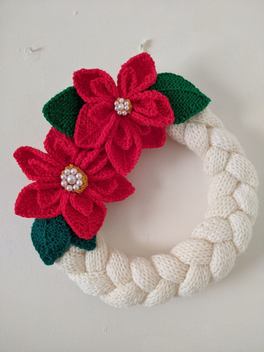 Knitted poinsettia wreath