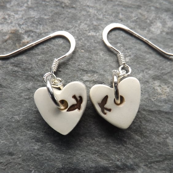 Handmade ceramic and sterling silver heart shaped swallows drop earrings