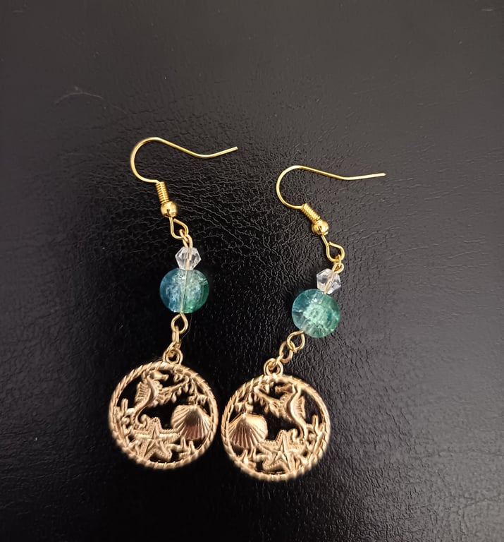 Gold beaded dangle earrings with nautical themed charms 