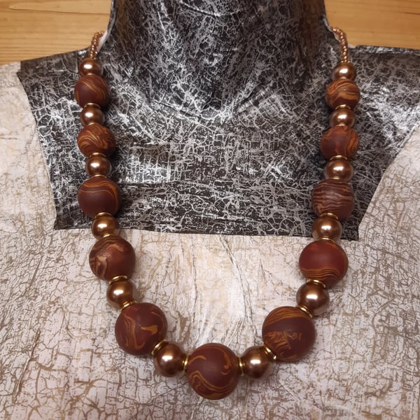 Elegant conker brown and bronze polymer clay necklace