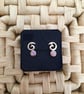 White Fire Faux Opal Studs with a Swirl - Image 1