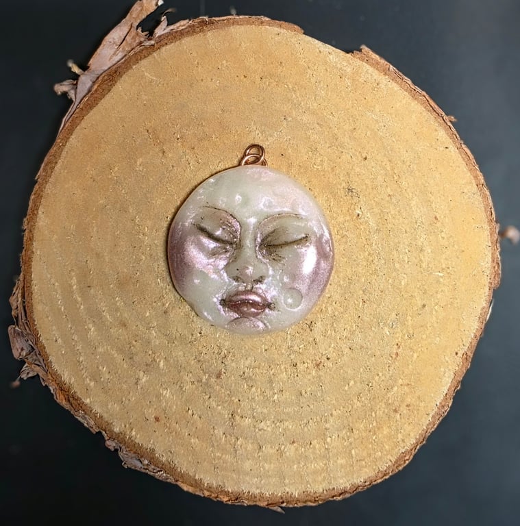 Hand sculpted moon face pendant